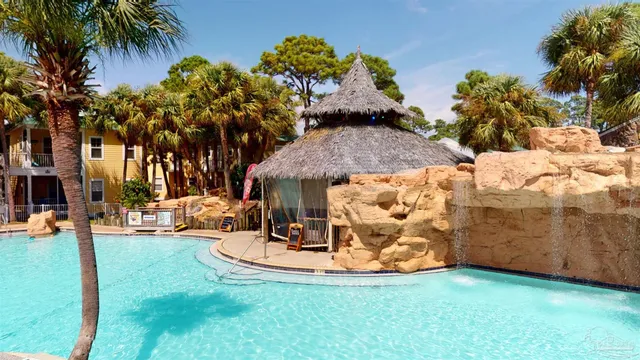 an ocean view with outdoor seating