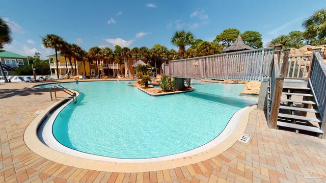 an aerial view of a house with outdoor space