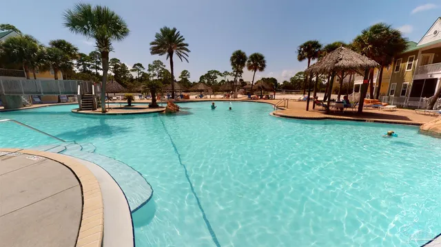 a view of a house with a flower garden