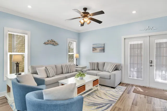 a living room with furniture and a large window