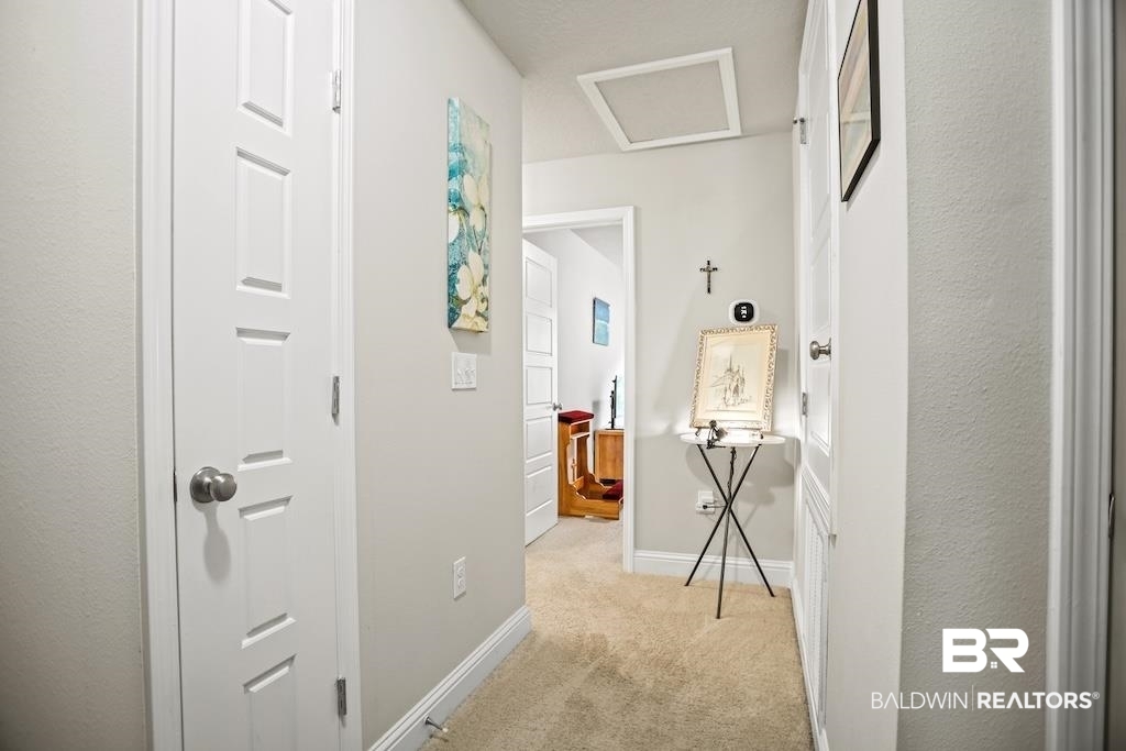 25806 Pollard Road, Unit 27 Daphne, AL 36526 - Photo 27 of 46 Hallway featuring attic access and light carpet