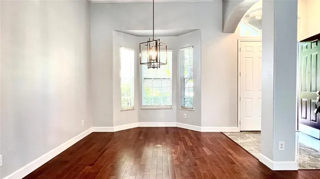 a large kitchen with kitchen island a sink stainless steel appliances and cabinets