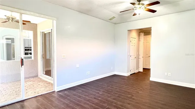 a view of staircase with a floor to ceiling window and wooden floor