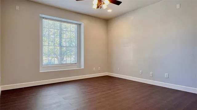 an aerial view of residential houses with outdoor space and lake view