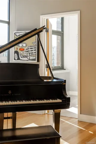 a bedroom with a bed couch and window