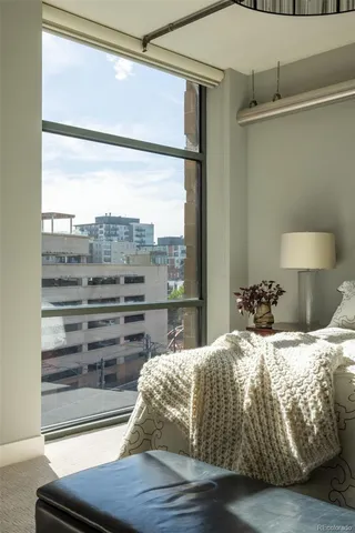 a bedroom with a bed and chair