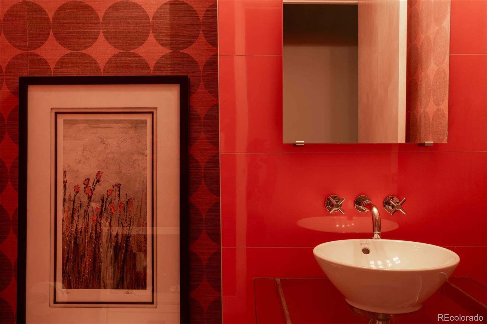 2100 16th St Mall, Unit 607 Denver, CO 80202 - Photo 23 of 46 a bathroom with a sink and a mirror