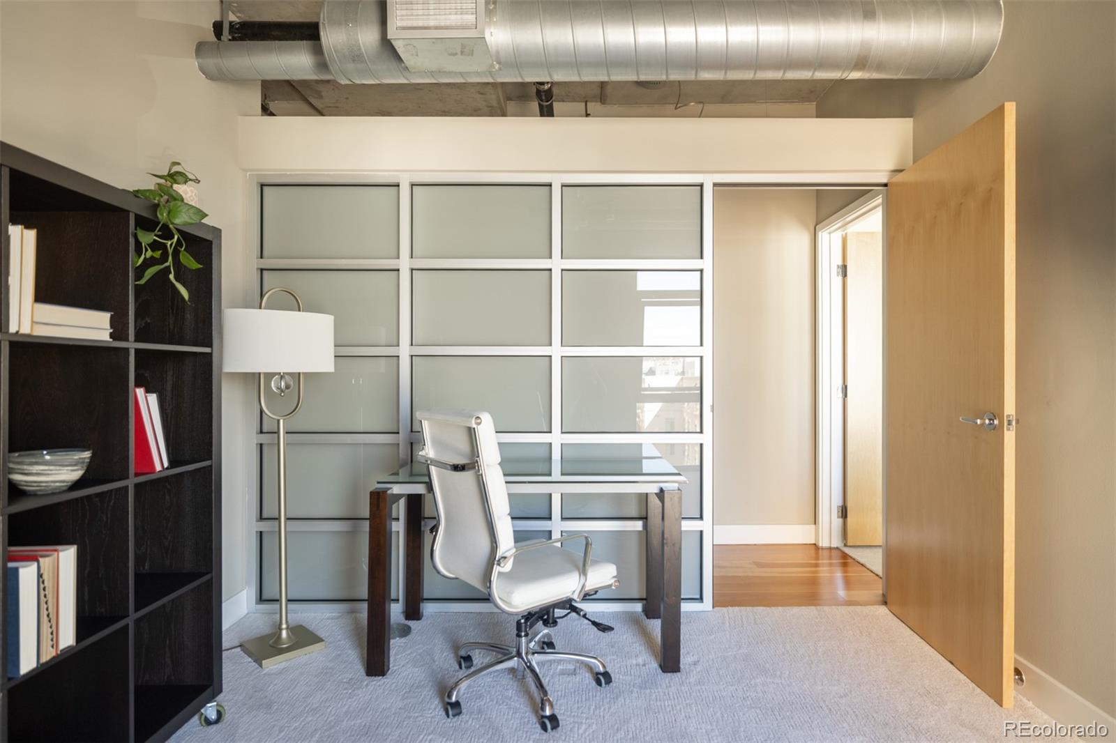 2100 16th St Mall, Unit 607 Denver, CO 80202 - Photo 26 of 46 a view of a room with shelves
