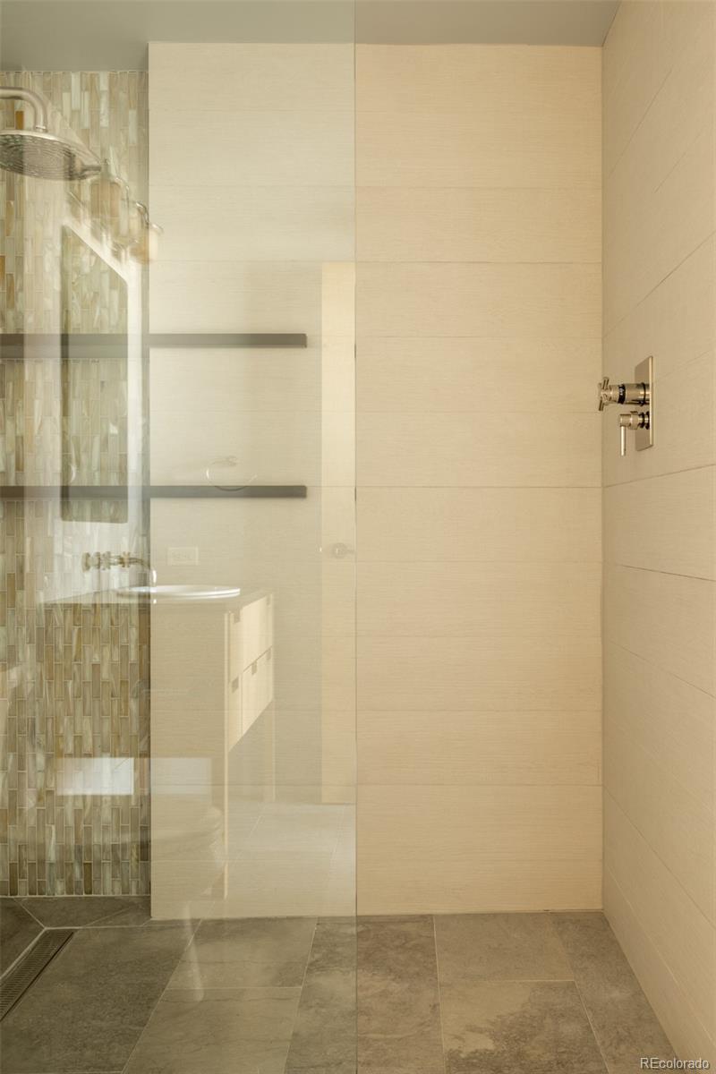 2100 16th St Mall, Unit 607 Denver, CO 80202 - Photo 35 of 46 a bathroom with a shower