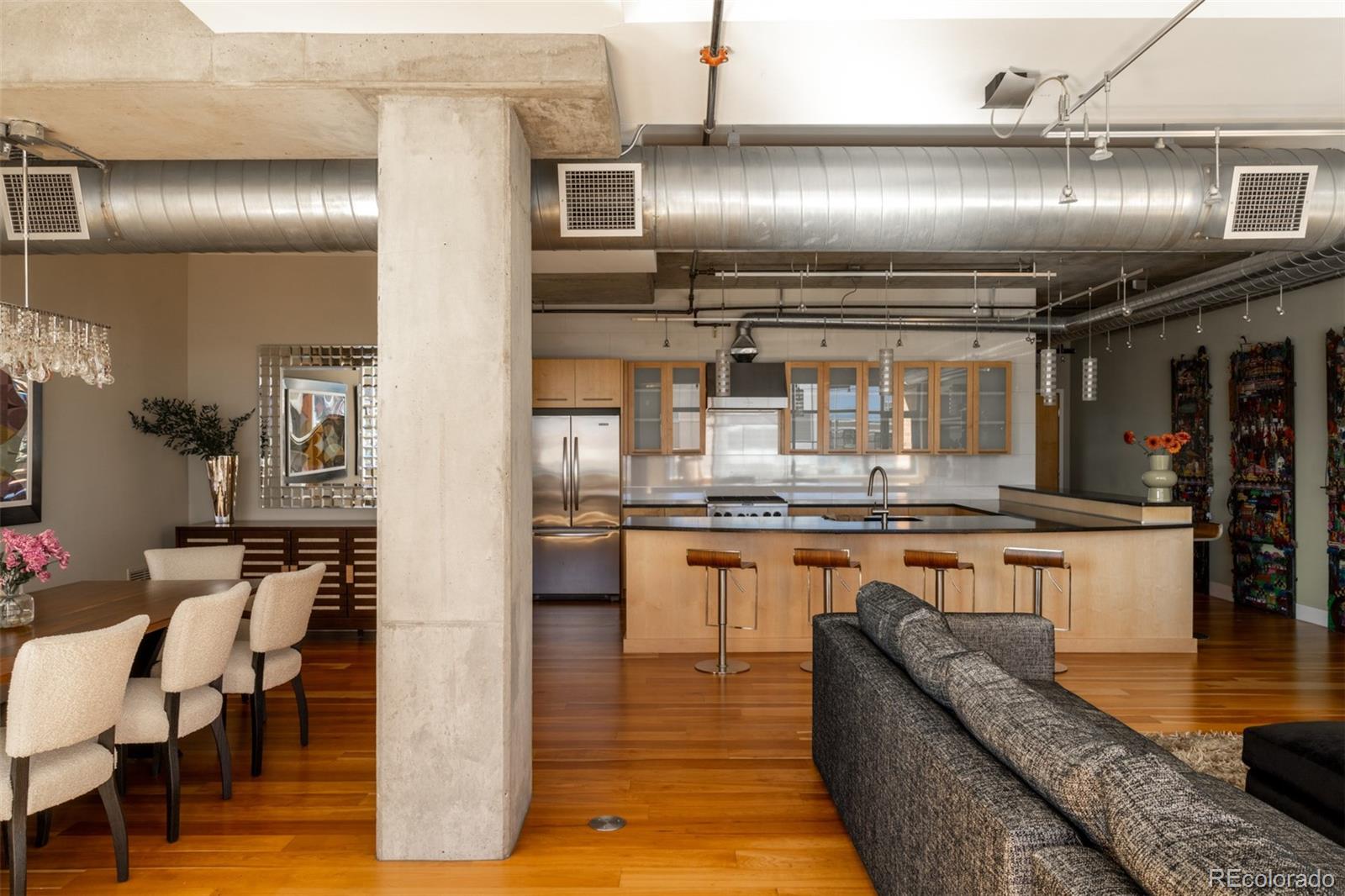 2100 16th St Mall, Unit 607 Denver, CO 80202 - Photo 7 of 46 a kitchen with granite countertop lots of counter top space