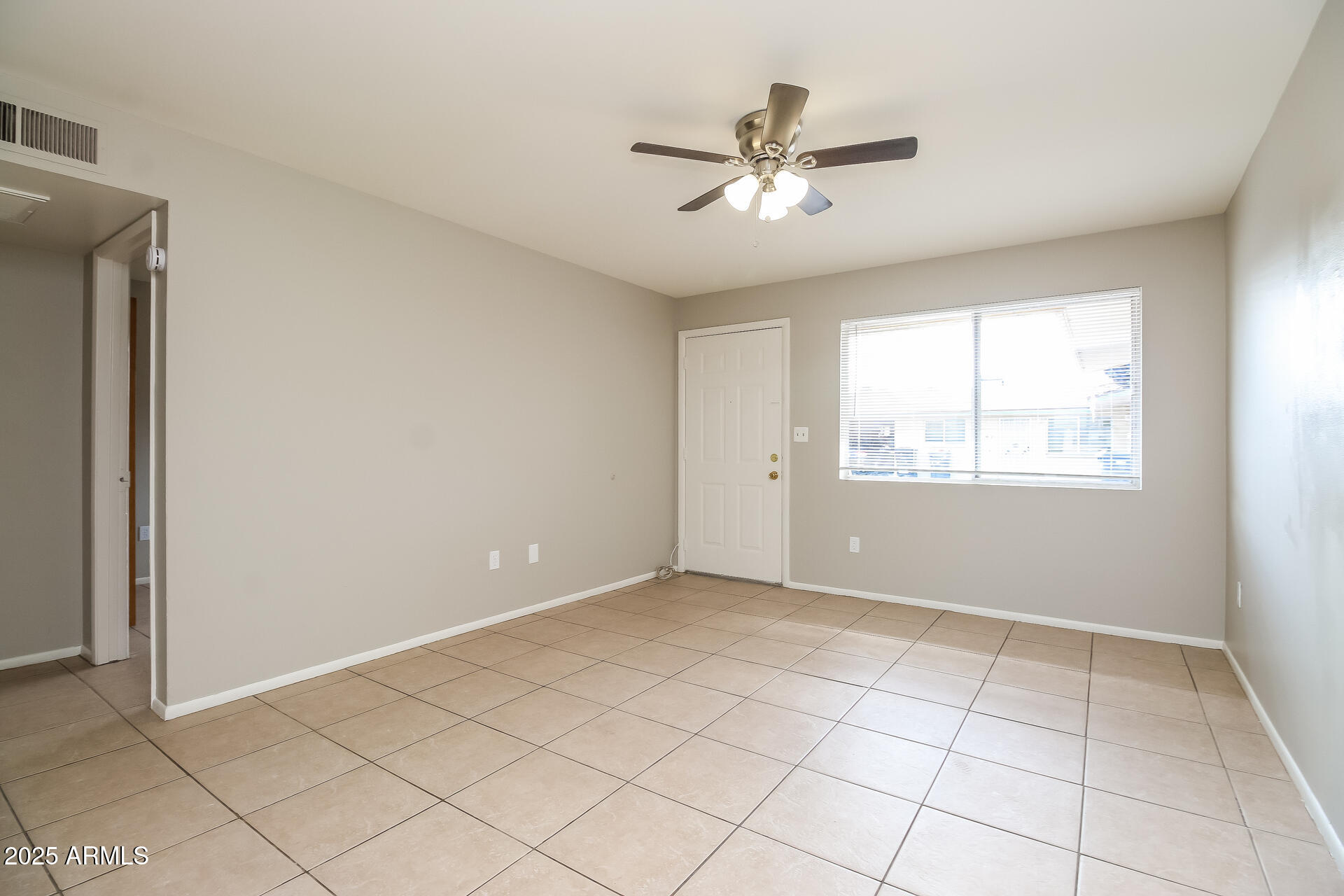 826 East 4th Place, Unit B Mesa, AZ 85203 - Photo 2 of 11 a view of an empty room with a window