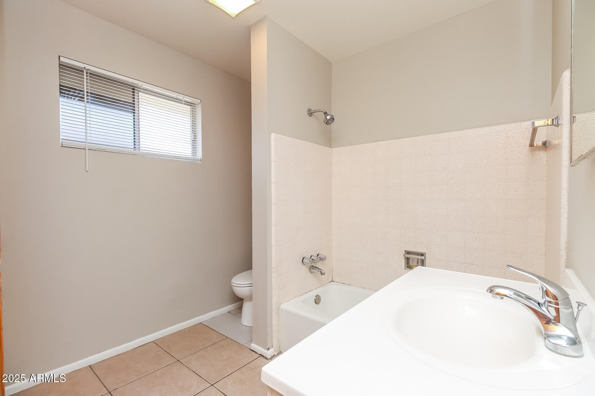 826 East 4th Place, Unit B Mesa, AZ 85203 - Photo 9 of 11 a bathroom with a sink and toilet