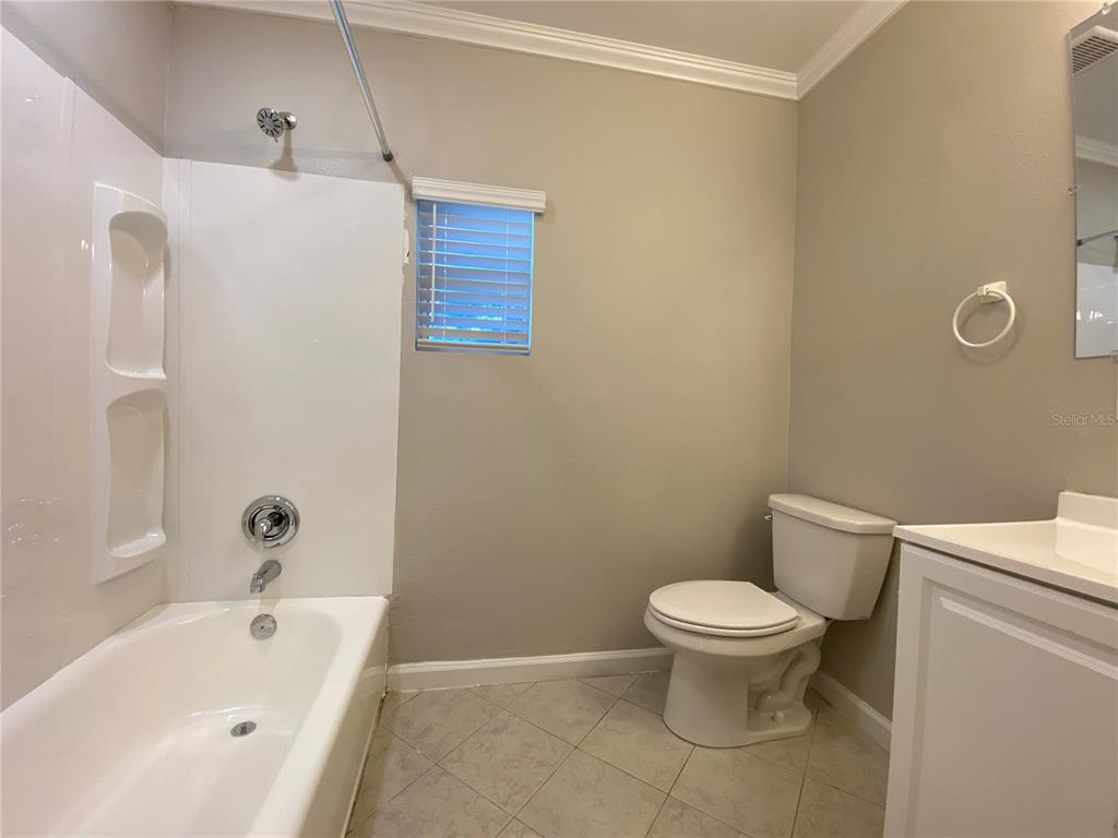 16131 Wallace Street Umatilla, FL 32784 - Photo 11 of 15 a bathroom with a toilet and a sink