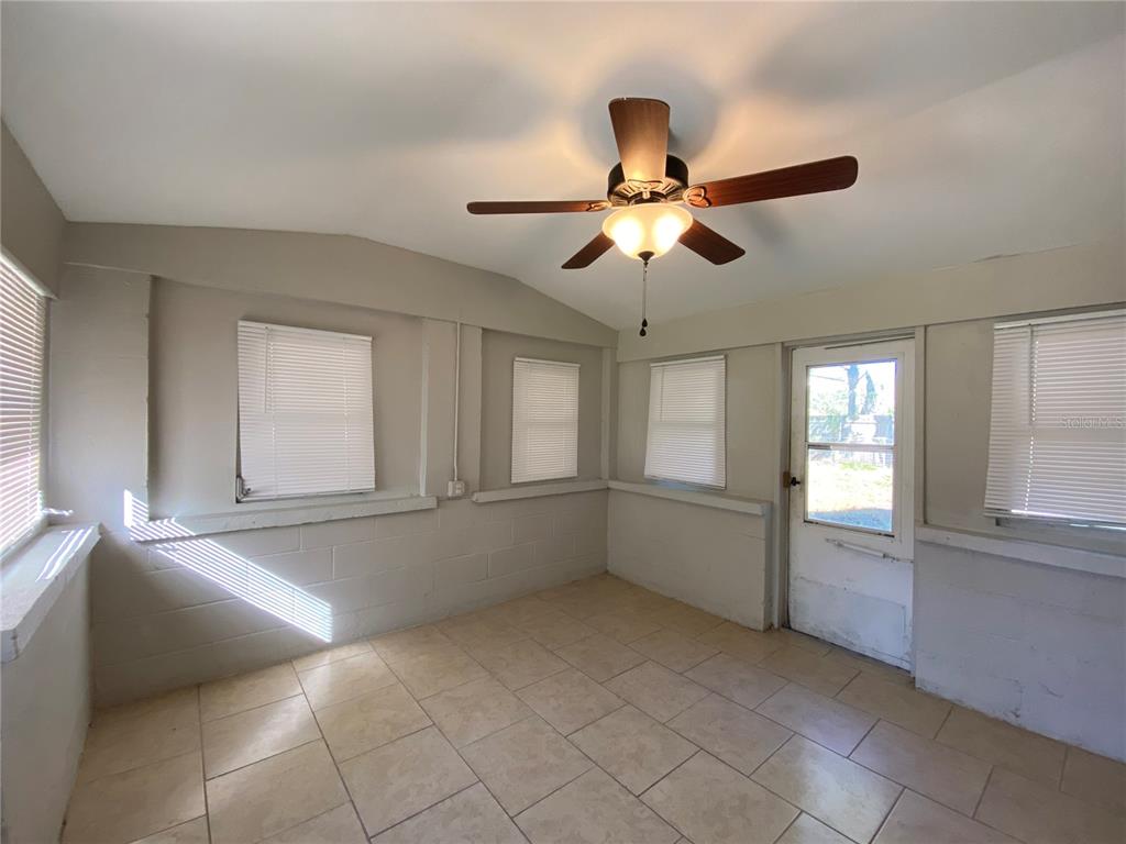 16131 Wallace Street Umatilla, FL 32784 - Photo 13 of 15 a view of an empty room with a window