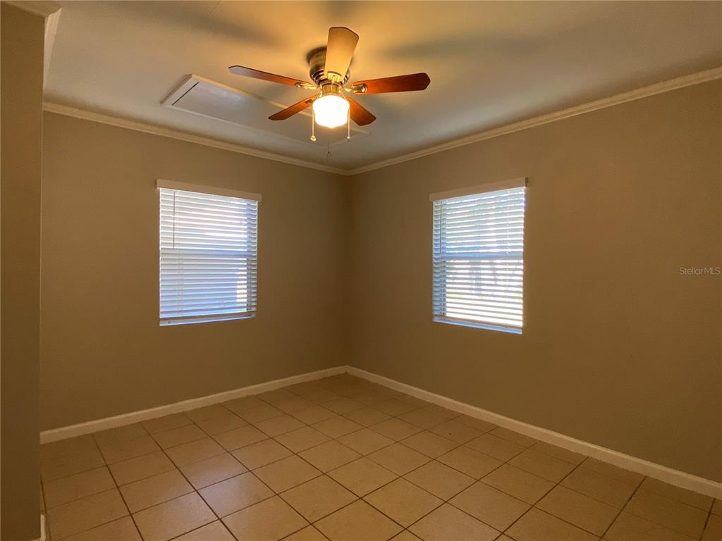 16131 Wallace Street Umatilla, FL 32784 - Photo 7 of 15 a view of an empty room with a window
