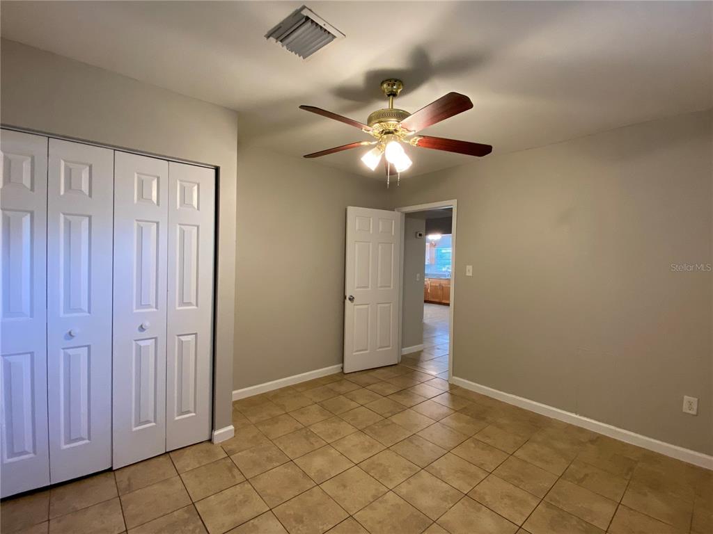16131 Wallace Street Umatilla, FL 32784 - Photo 10 of 15 wooden floor in an empty room