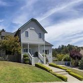 a view of a house with backyard porch and furniture
