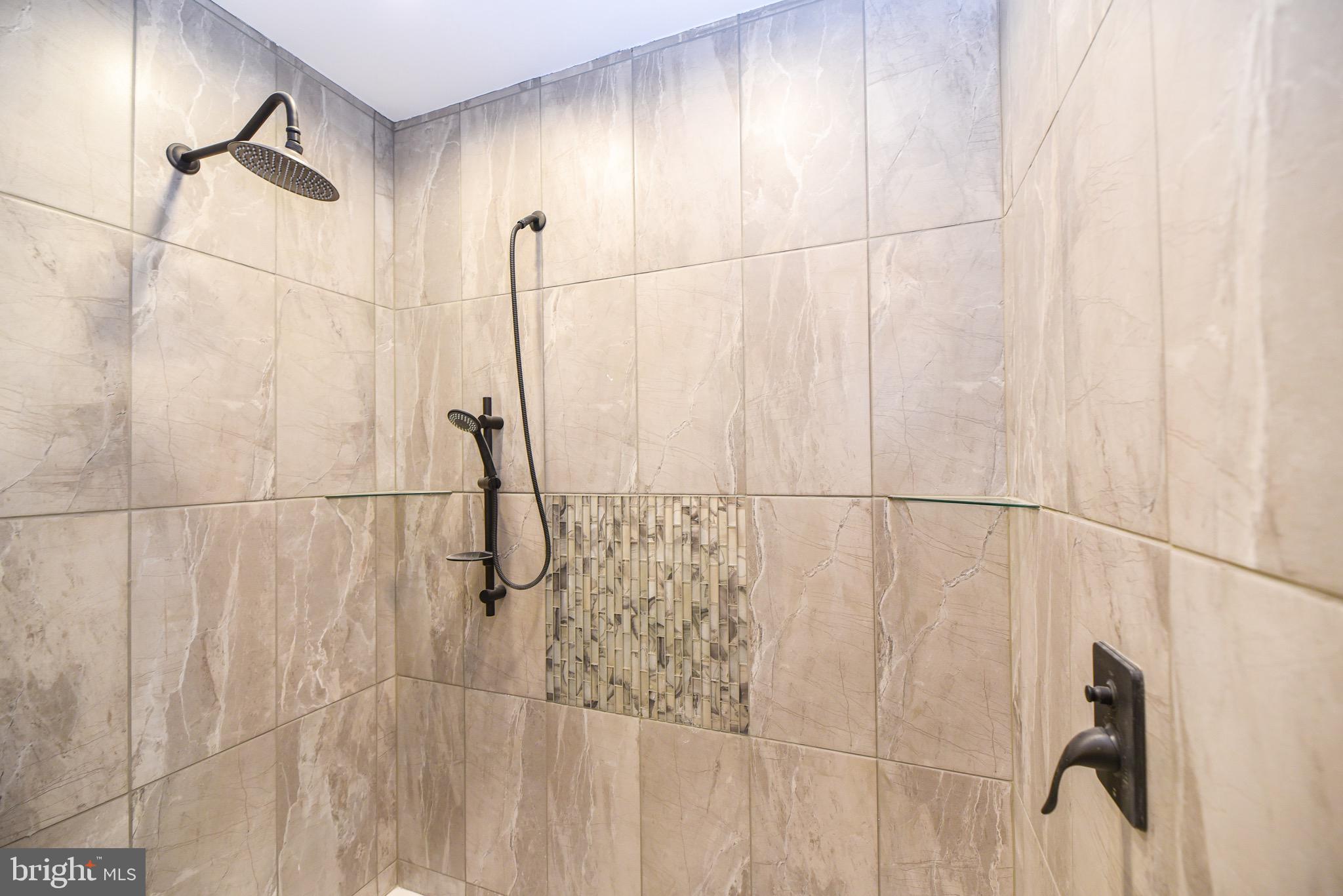 26363 West Pintail Road, Unit 78 Millsboro, DE 19966 - Photo 15 of 40 a bathroom with a shower
