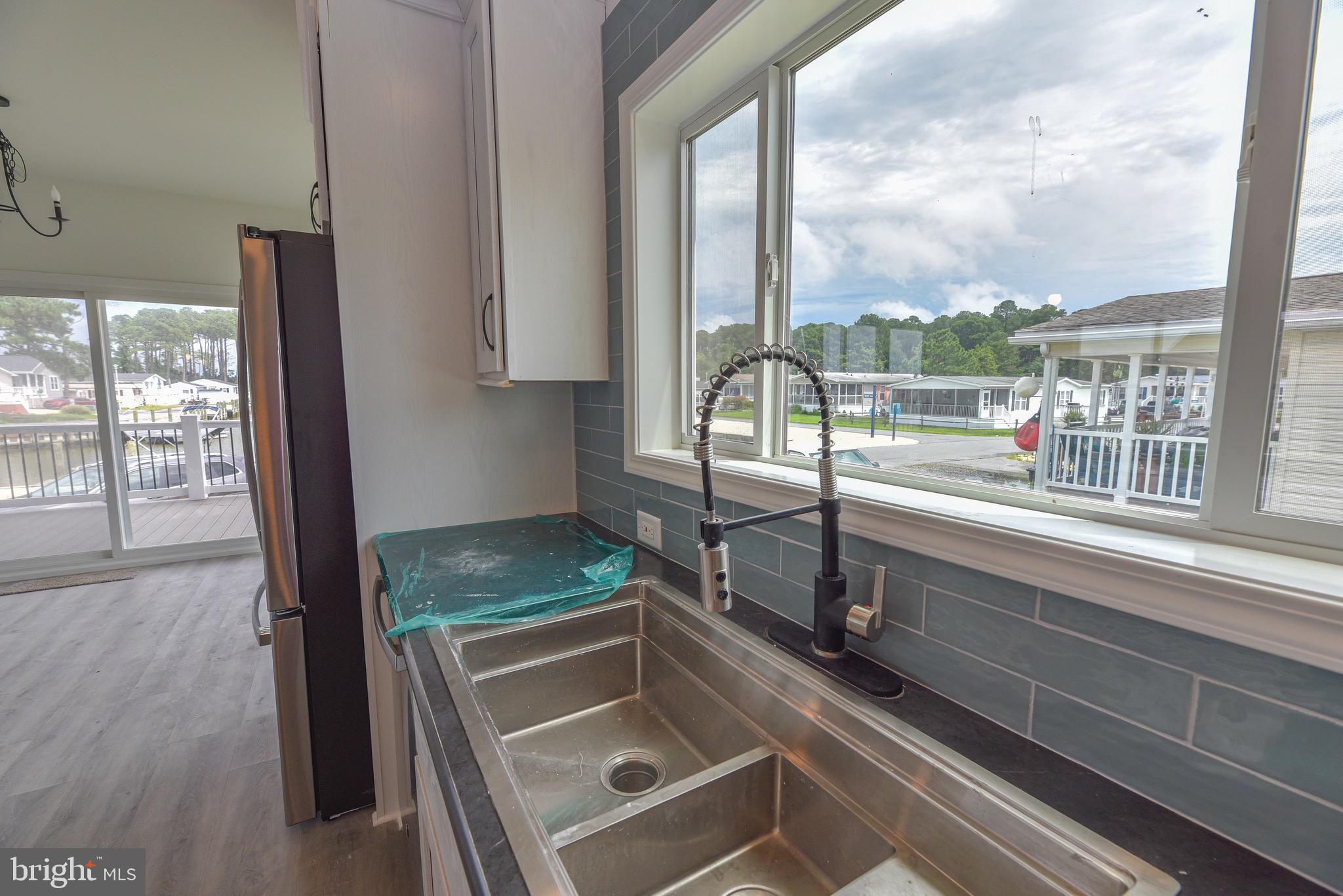 26363 West Pintail Road, Unit 78 Millsboro, DE 19966 - Photo 35 of 40 a room with gym equipment and a large window