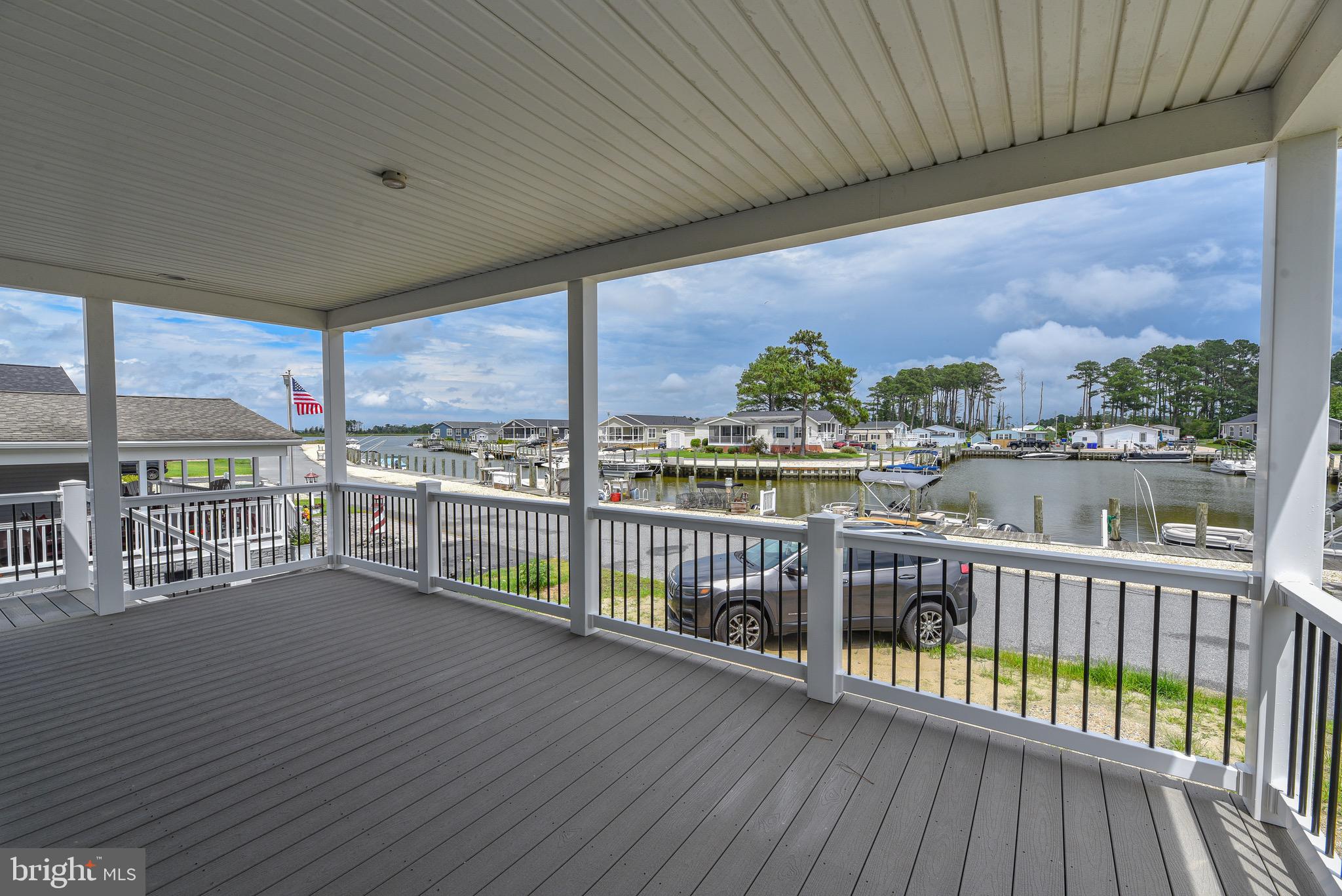 26363 West Pintail Road, Unit 78 Millsboro, DE 19966 - Photo 37 of 40 a view of a balcony with furniture