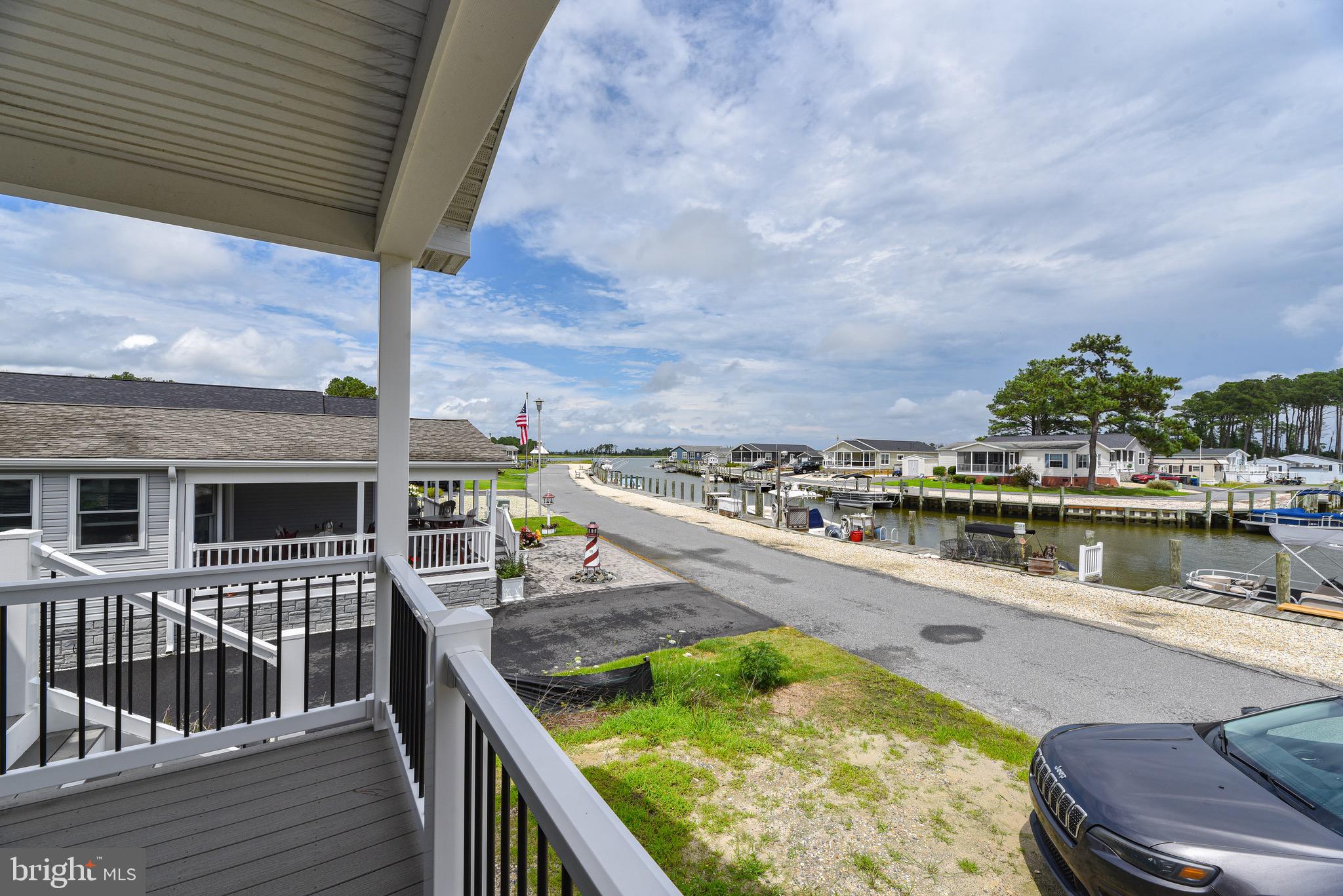 26363 West Pintail Road, Unit 78 Millsboro, DE 19966 - Photo 40 of 40 a view of a lake from a balcony