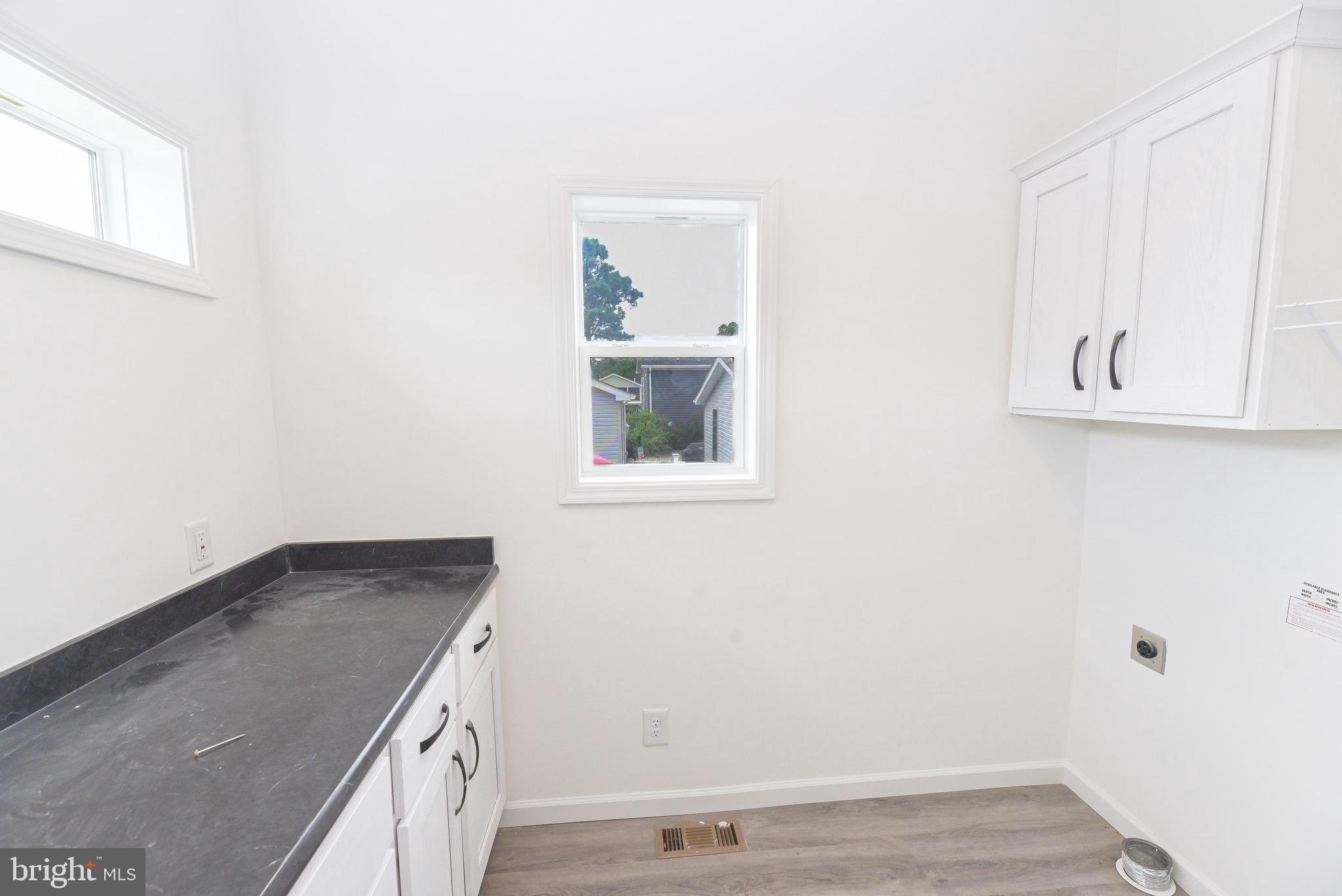 26363 West Pintail Road, Unit 78 Millsboro, DE 19966 - Photo 7 of 40 a view of a hallway with workspace