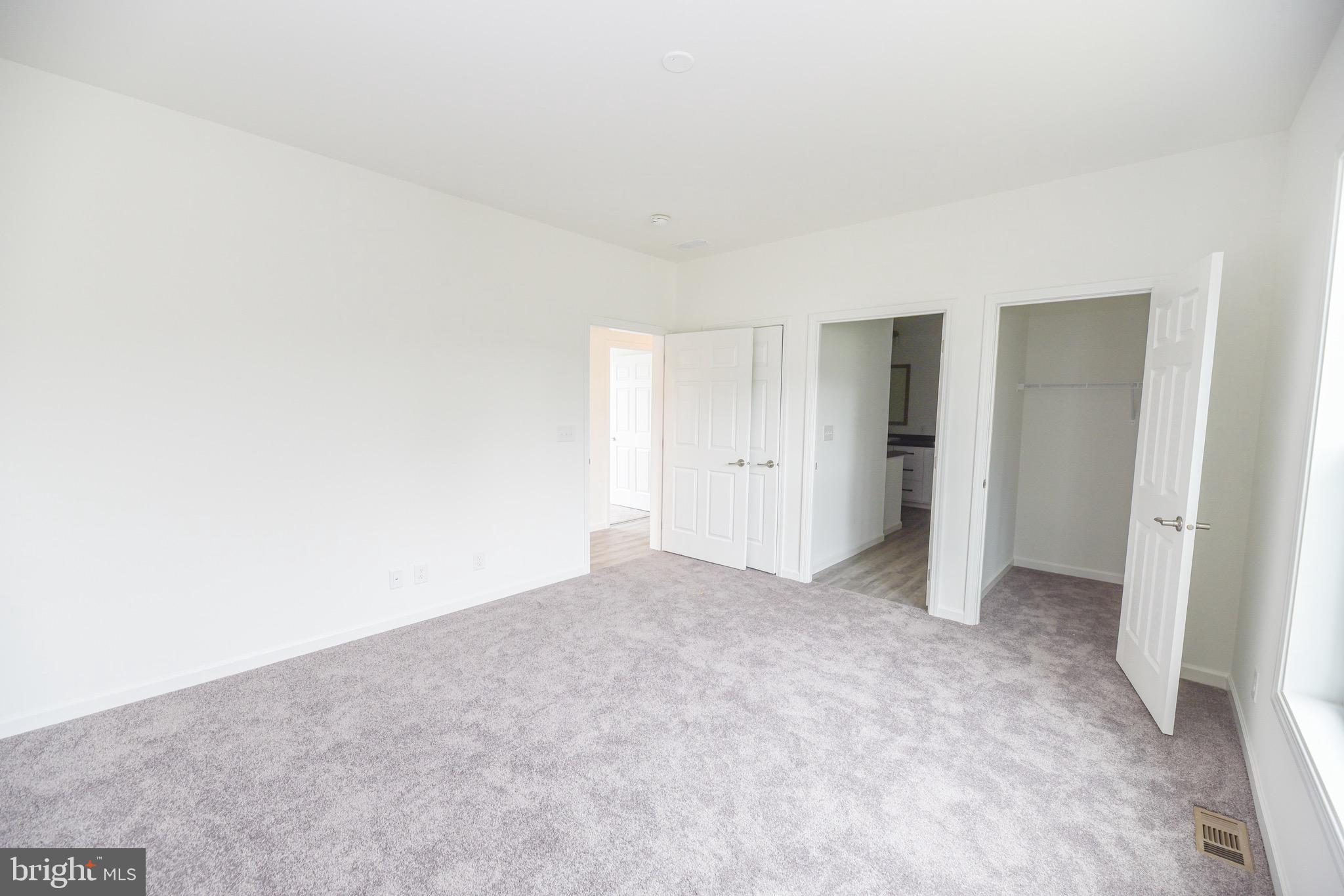 26363 West Pintail Road, Unit 78 Millsboro, DE 19966 - Photo 10 of 40 a view of an empty room and closet area