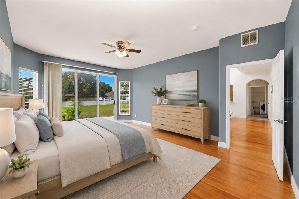936 Kingsridge Circle Gotha, FL 34734 - Photo 10 of 50 a bedroom with a large bed and a window