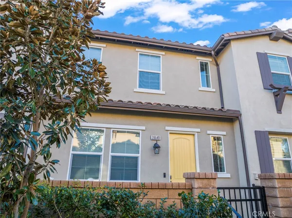 a front view of a house with yard