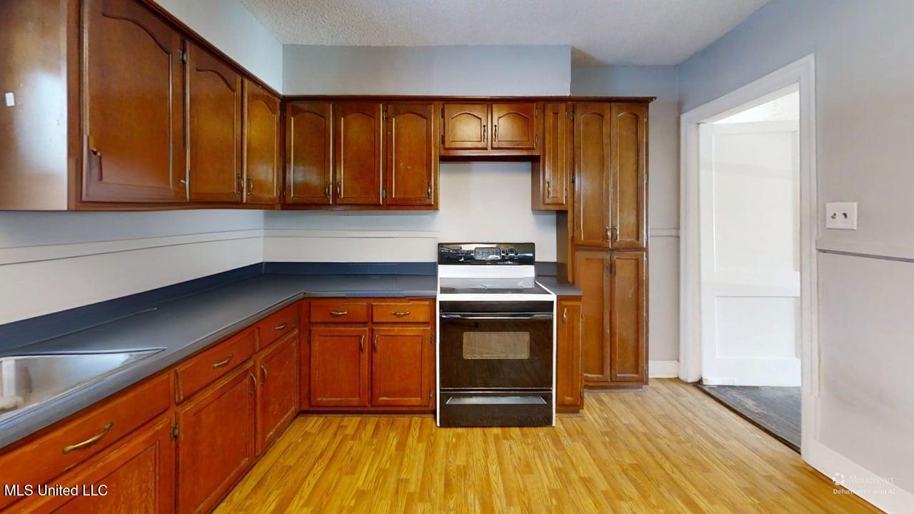 9338 East Broadway Road Olive Branch, MS 38654 - Photo 12 of 14 9338-E-Broadway-Rd-Kitchen-Defurnished 1