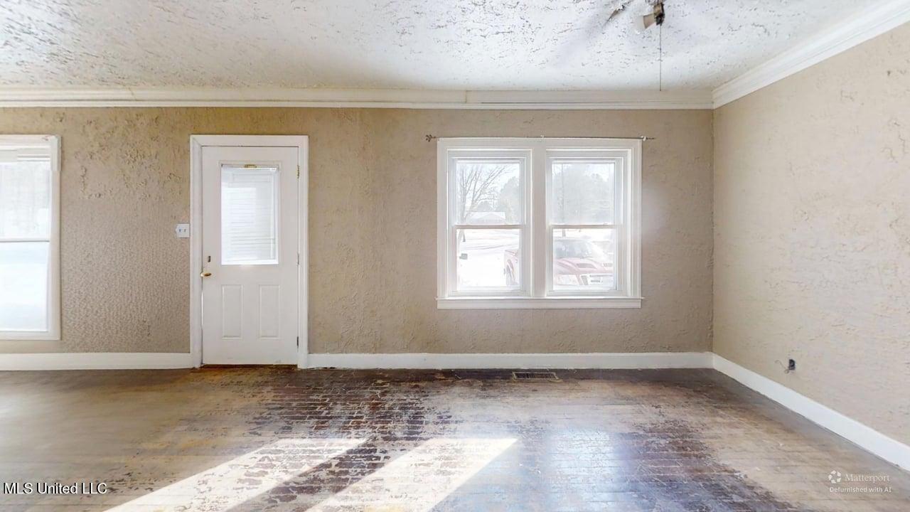 9338 East Broadway Road Olive Branch, MS 38654 - Photo 13 of 14 9338-E-Broadway-Rd-Living-Room-Defurnish