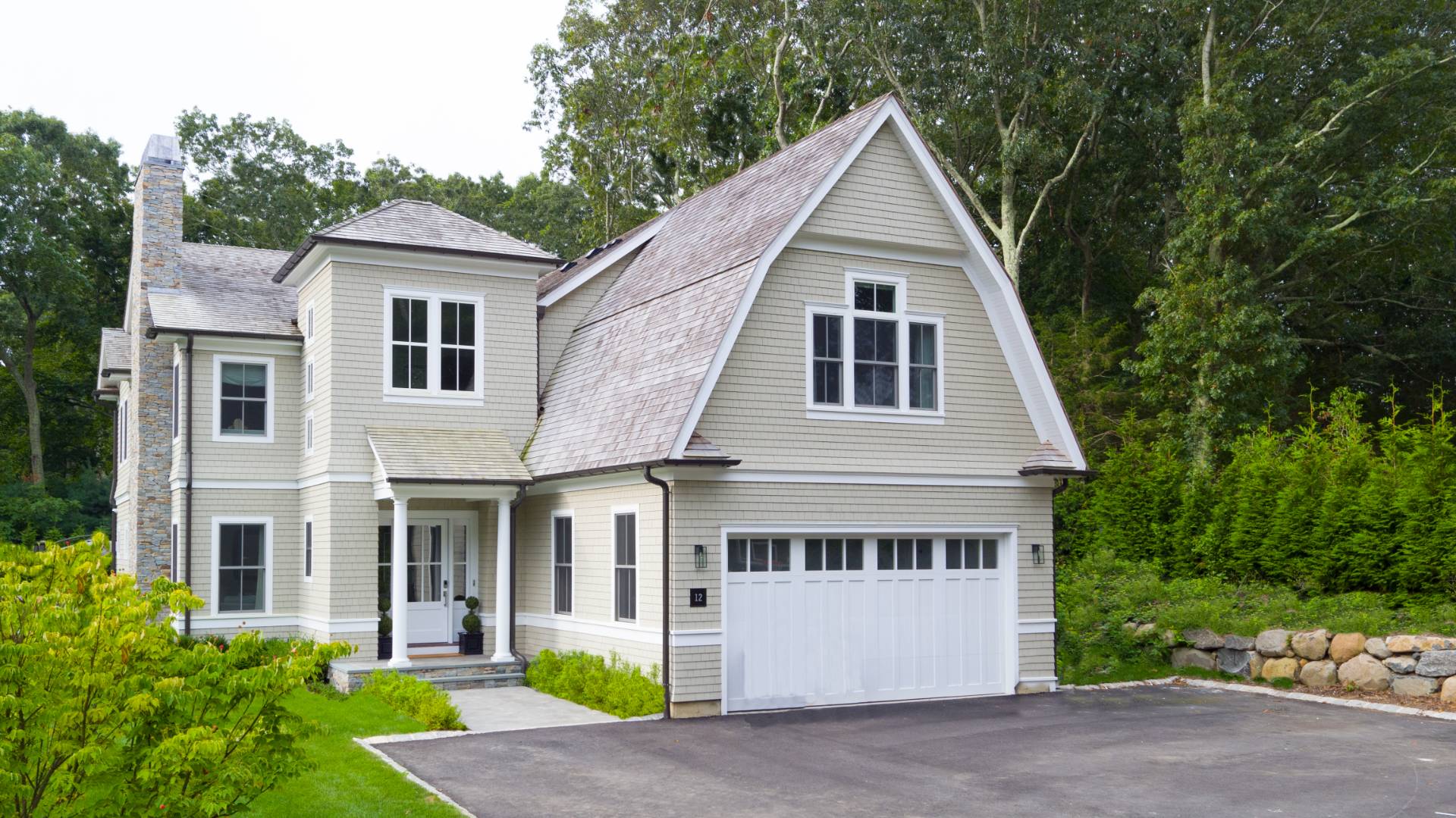 12 Sellentin Way Bridgehampton, NY 11932 - Photo 2 of 49 a front view of a house with a yard