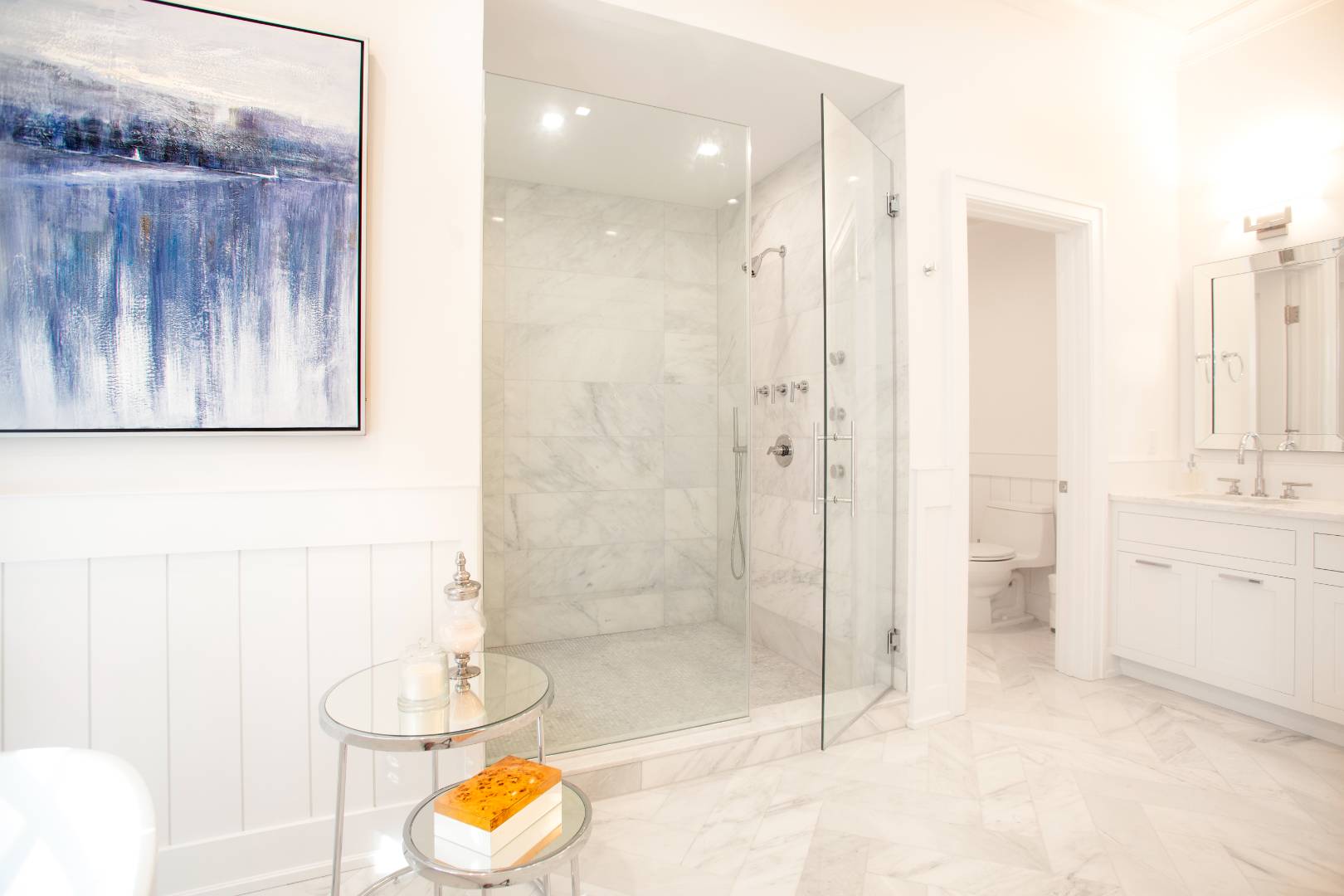 12 Sellentin Way Bridgehampton, NY 11932 - Photo 23 of 49 a bathroom with a granite countertop sink a toilet and shower