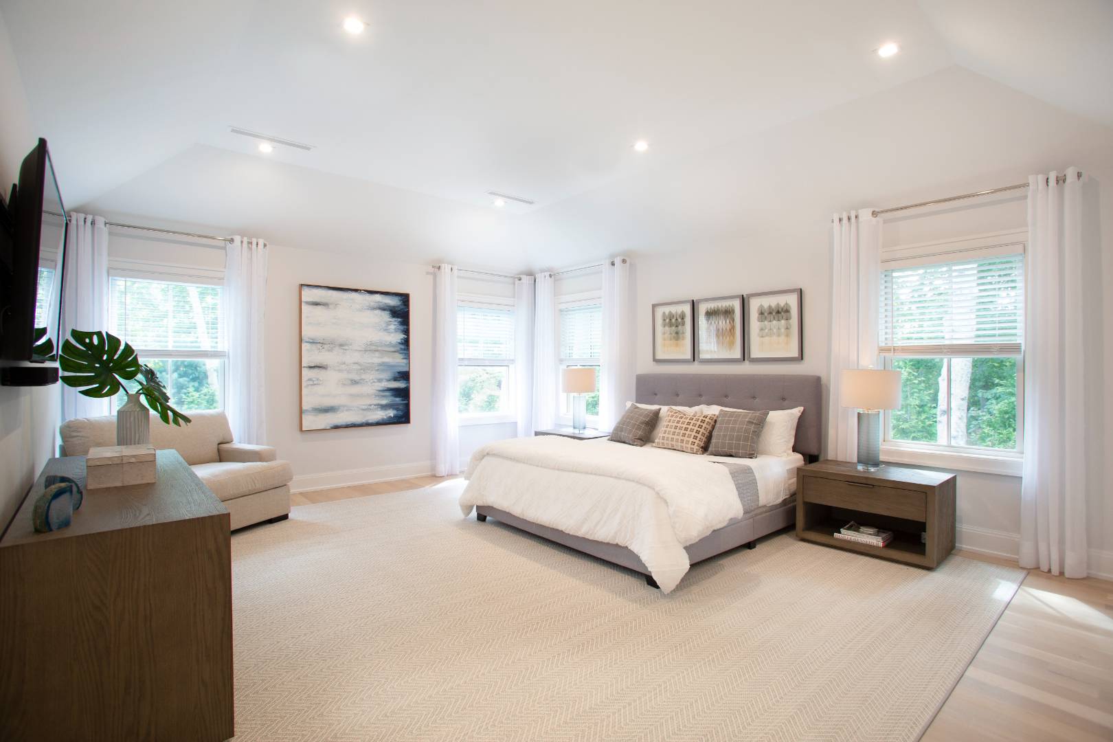 12 Sellentin Way Bridgehampton, NY 11932 - Photo 25 of 49 a spacious bedroom with a bed and a couch