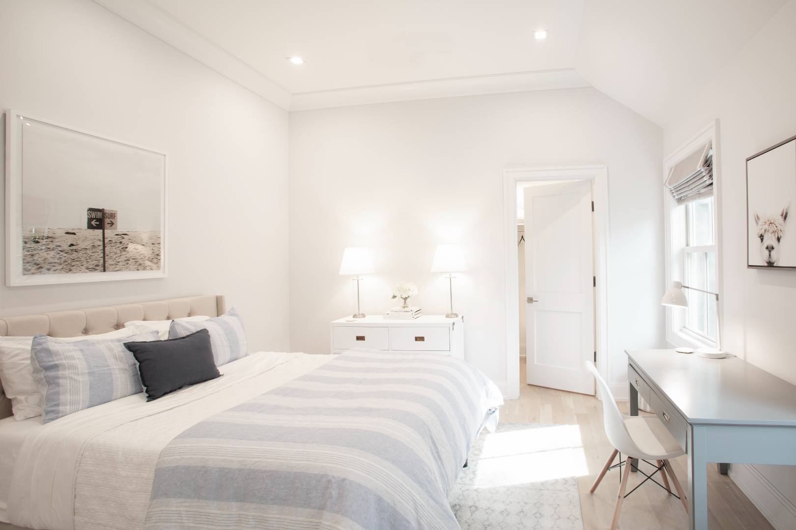 12 Sellentin Way Bridgehampton, NY 11932 - Photo 32 of 49 a bedroom with bed and a painting on the wall