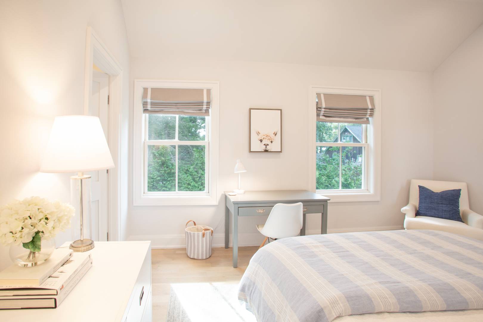 12 Sellentin Way Bridgehampton, NY 11932 - Photo 33 of 49 a bedroom with a bed and a window
