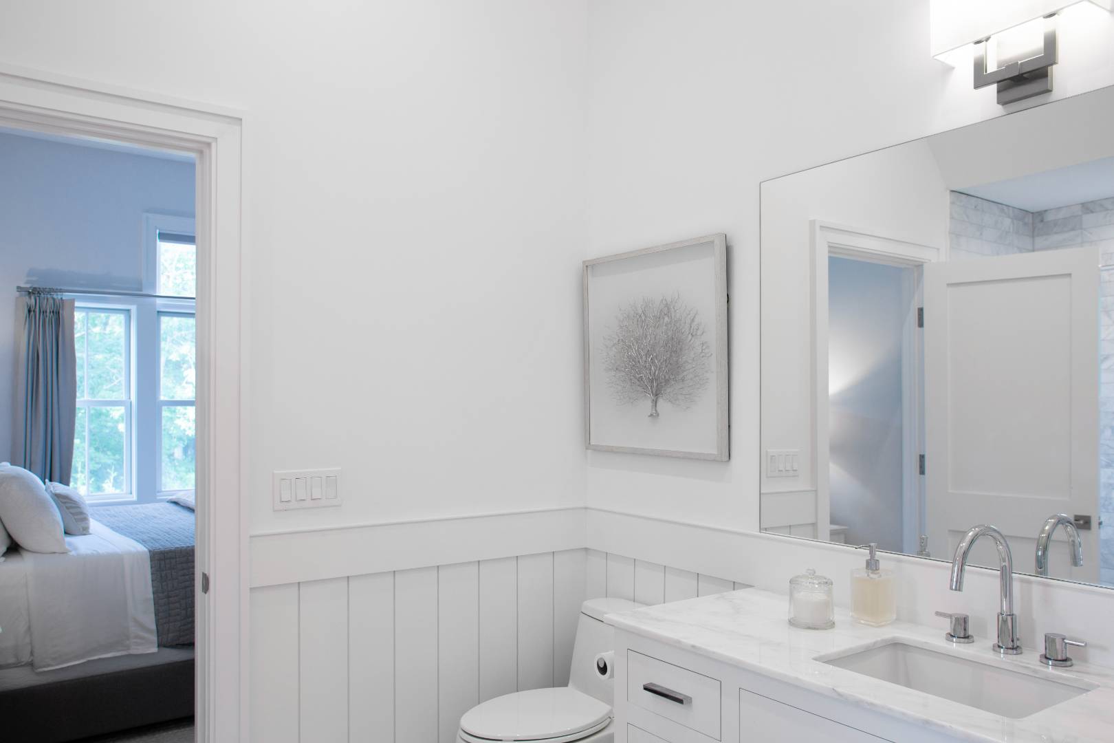 12 Sellentin Way Bridgehampton, NY 11932 - Photo 34 of 49 a bathroom with a toilet a sink and mirror