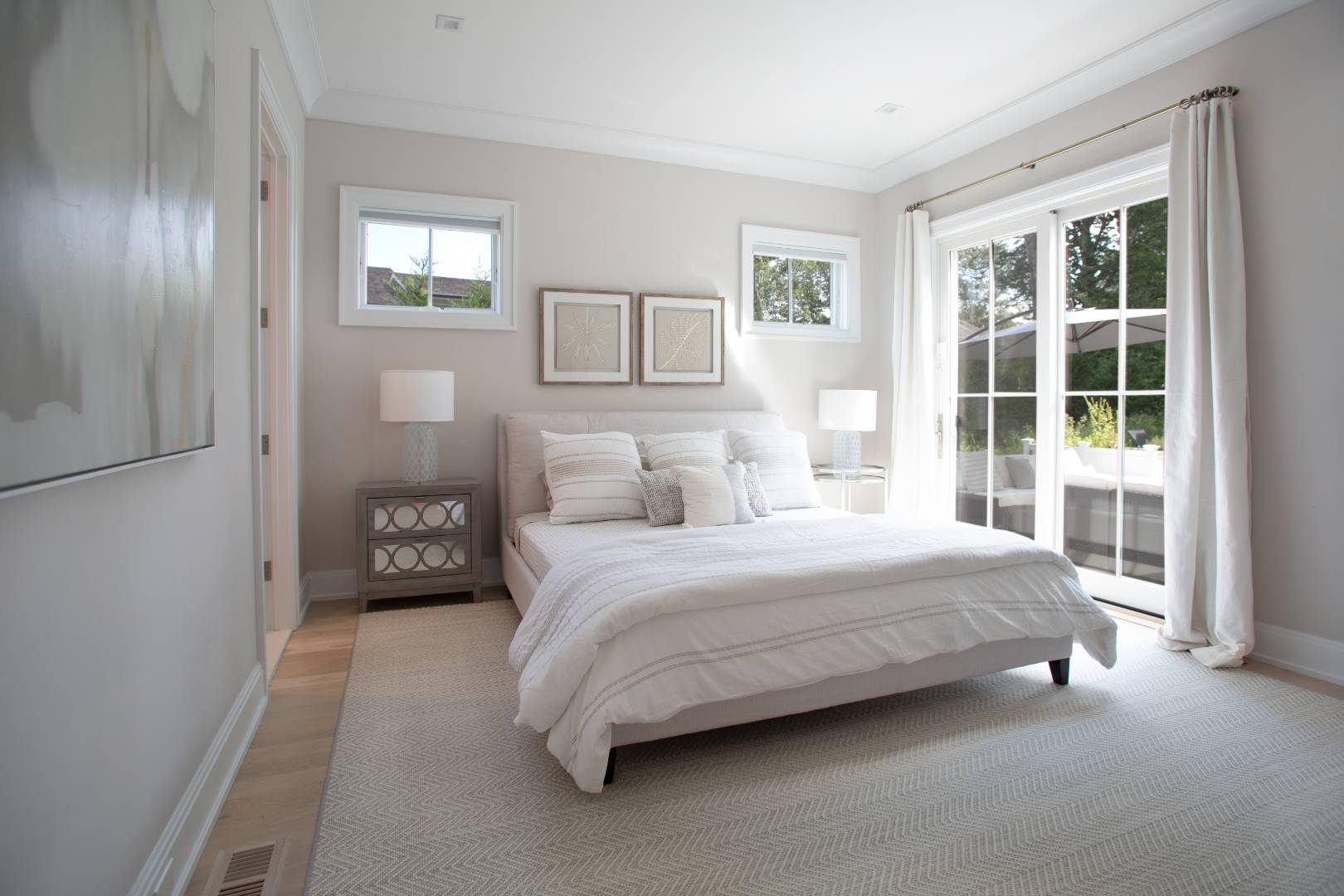 12 Sellentin Way Bridgehampton, NY 11932 - Photo 37 of 49 a bedroom with a bed lamp and a window