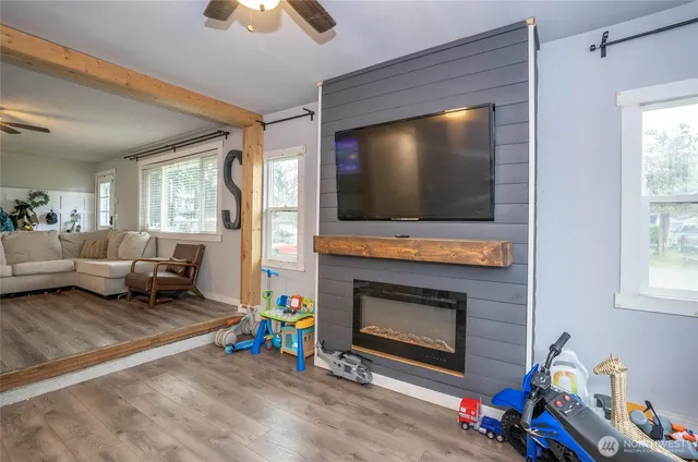a living room with furniture and a flat screen tv