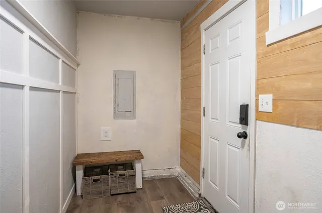 a room with a bench and a window