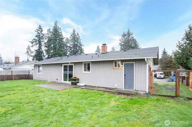 a house view with a sitting space and garden