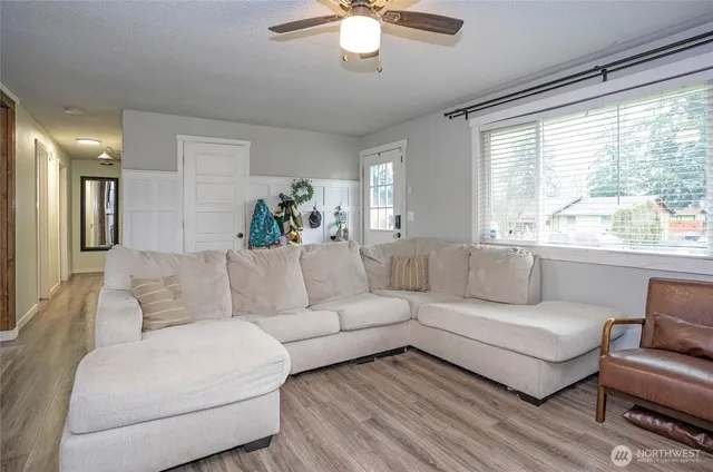 a living room with furniture and a large window