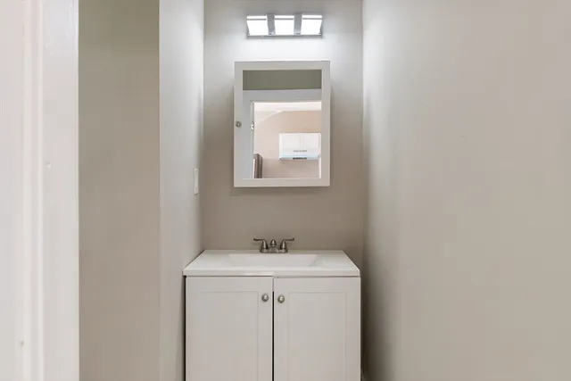 a utility room with a sink dryer and washer