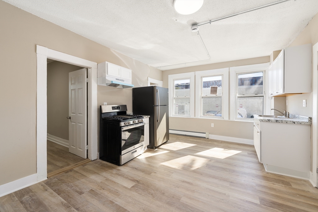 50 Common Street, Unit 5 Lawrence, MA 01840 - Photo 17 of 28 a view of kitchen with sink and refrigerator