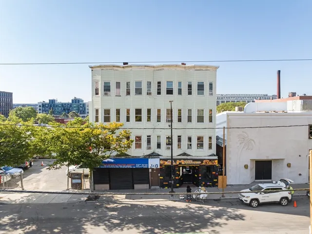 a view of a building with a street
