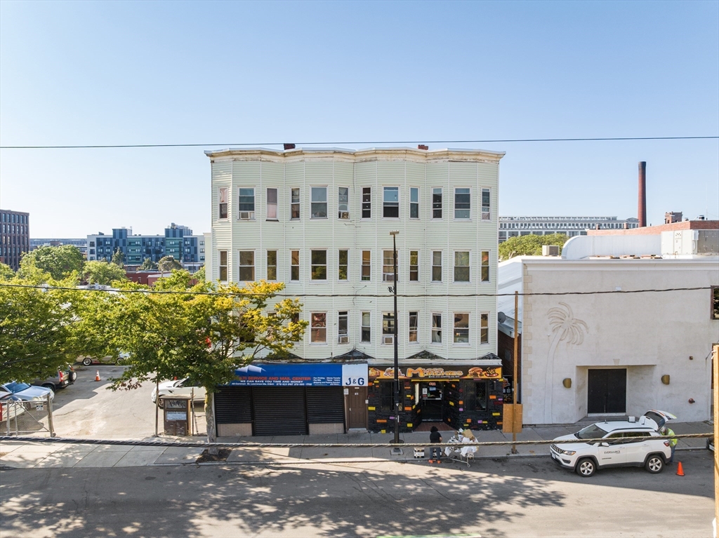 50 Common Street, Unit 5 Lawrence, MA 01840 - Photo 2 of 28 a view of a building with a street