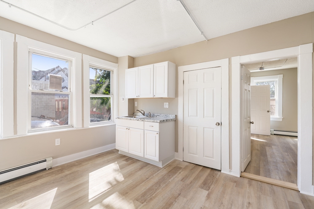 50 Common Street, Unit 5 Lawrence, MA 01840 - Photo 22 of 28 a room with a bed and a window