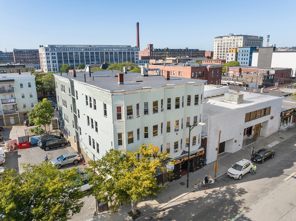 50 Common Street, Unit 5 Lawrence, MA 01840 - Photo 28 of 28 a view of a building with a garden