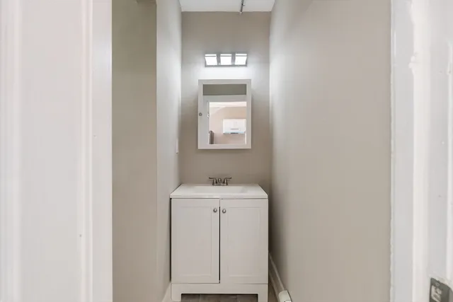a bathroom with a sink and a mirror