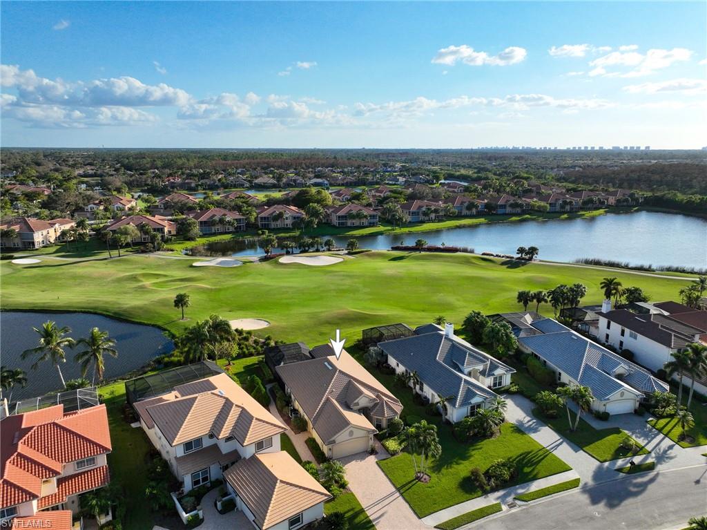6048 Fairway Court Naples, FL 34110 - Photo 24 of 49 an aerial view of a houses with outdoor space lake view and mountain view in back